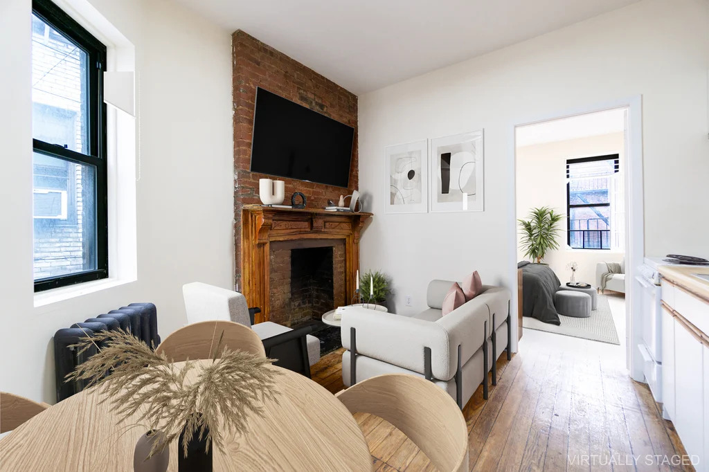 Living room with exposed brick and windows in Manhattan
