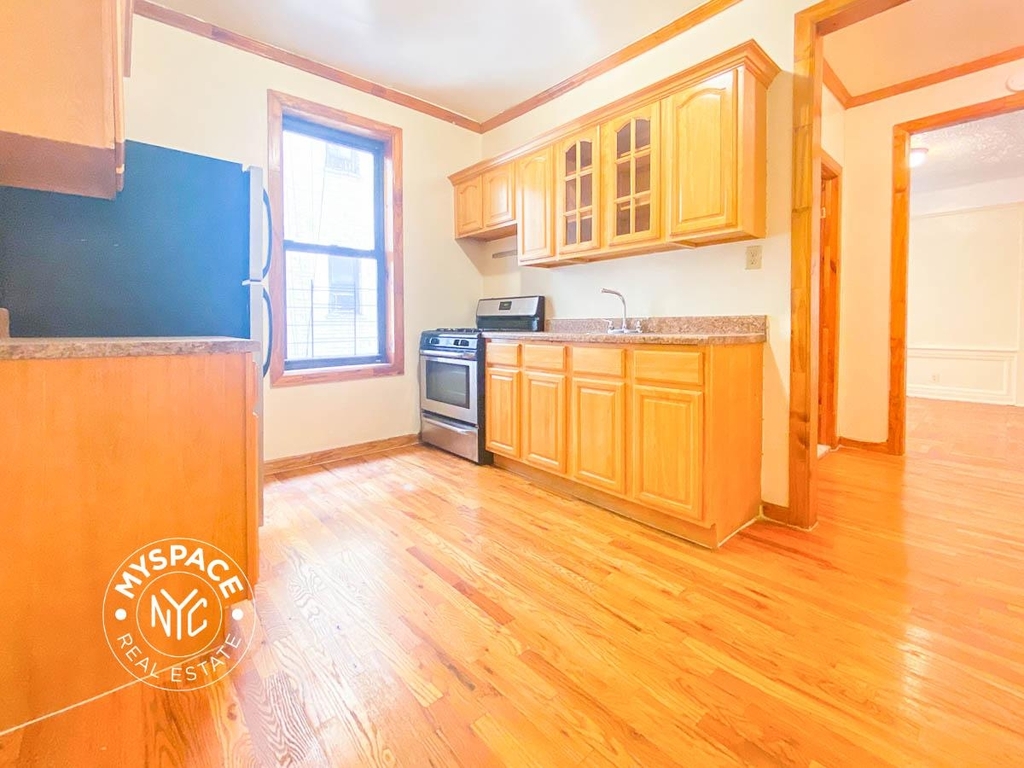 Kitchen in Brooklyn with hardwood floors