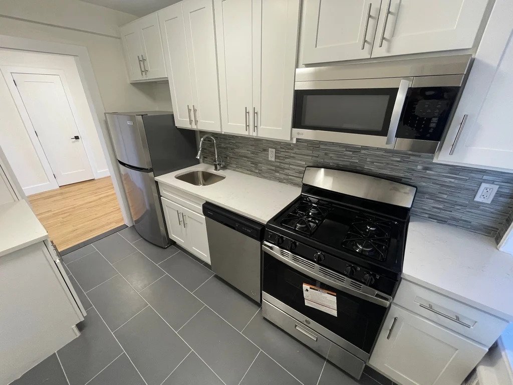 Queens kitchen with stainless steel appliances