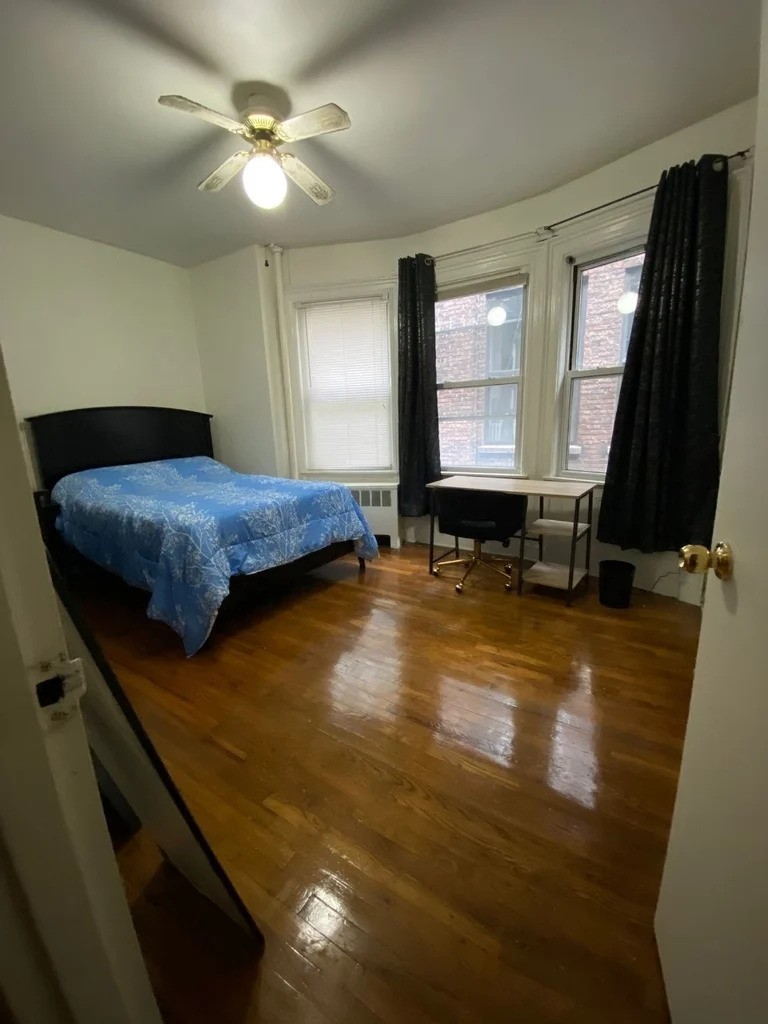 Manhattan bedroom with multiple windows