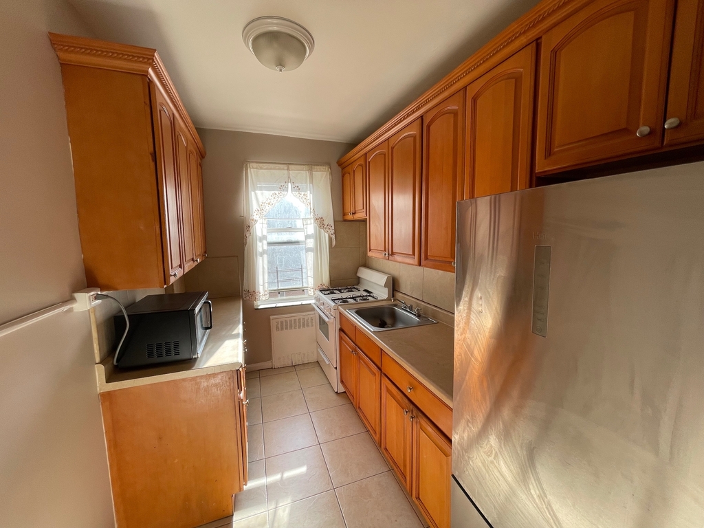 Queens listing kitchen with light wood cabinets