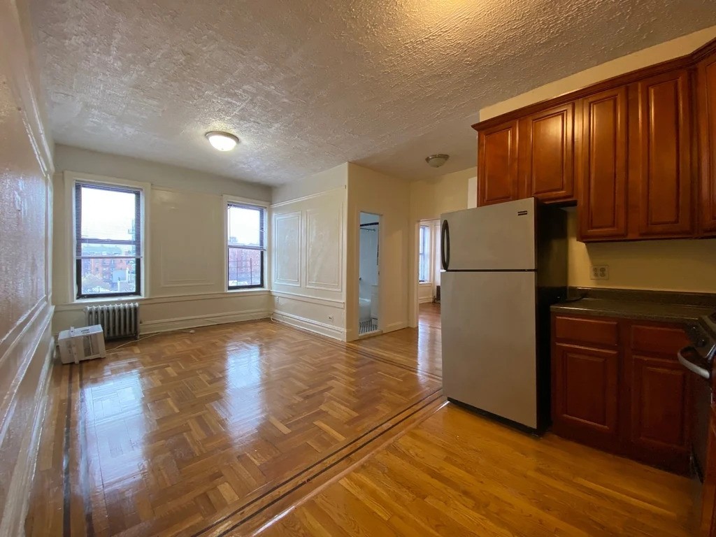 Brooklyn kitchen with exposed stainless steel appliances