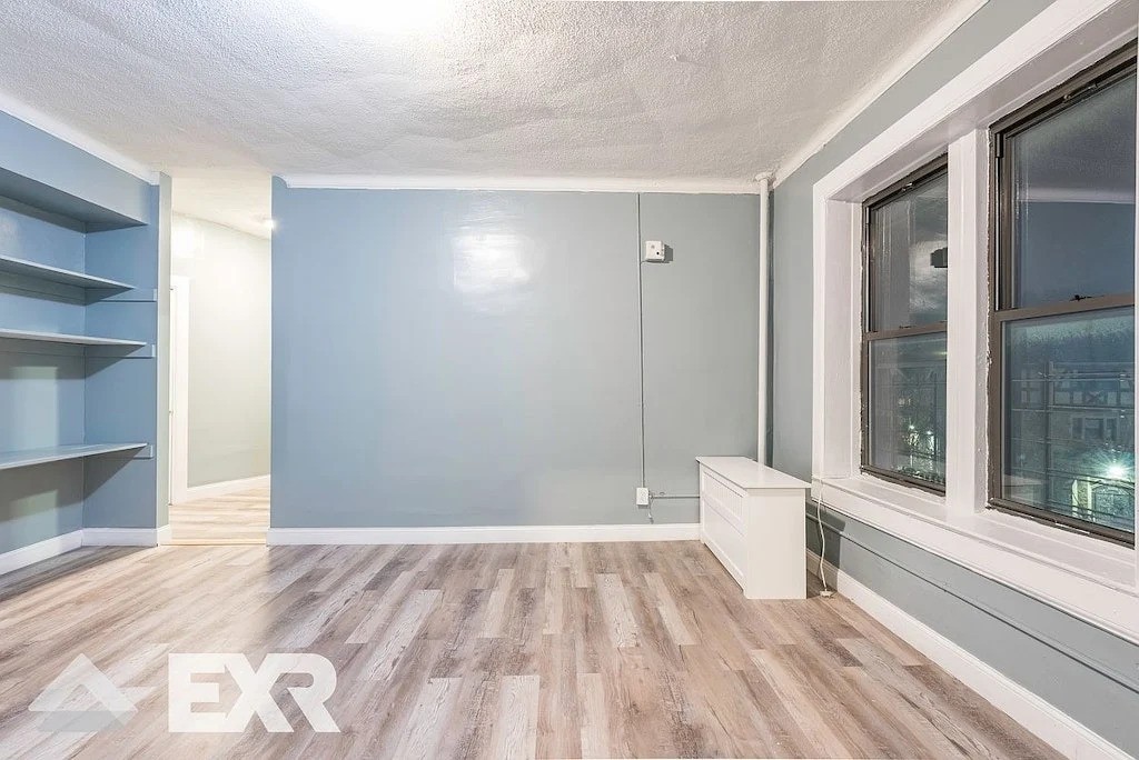 Living room with windows and blue walls