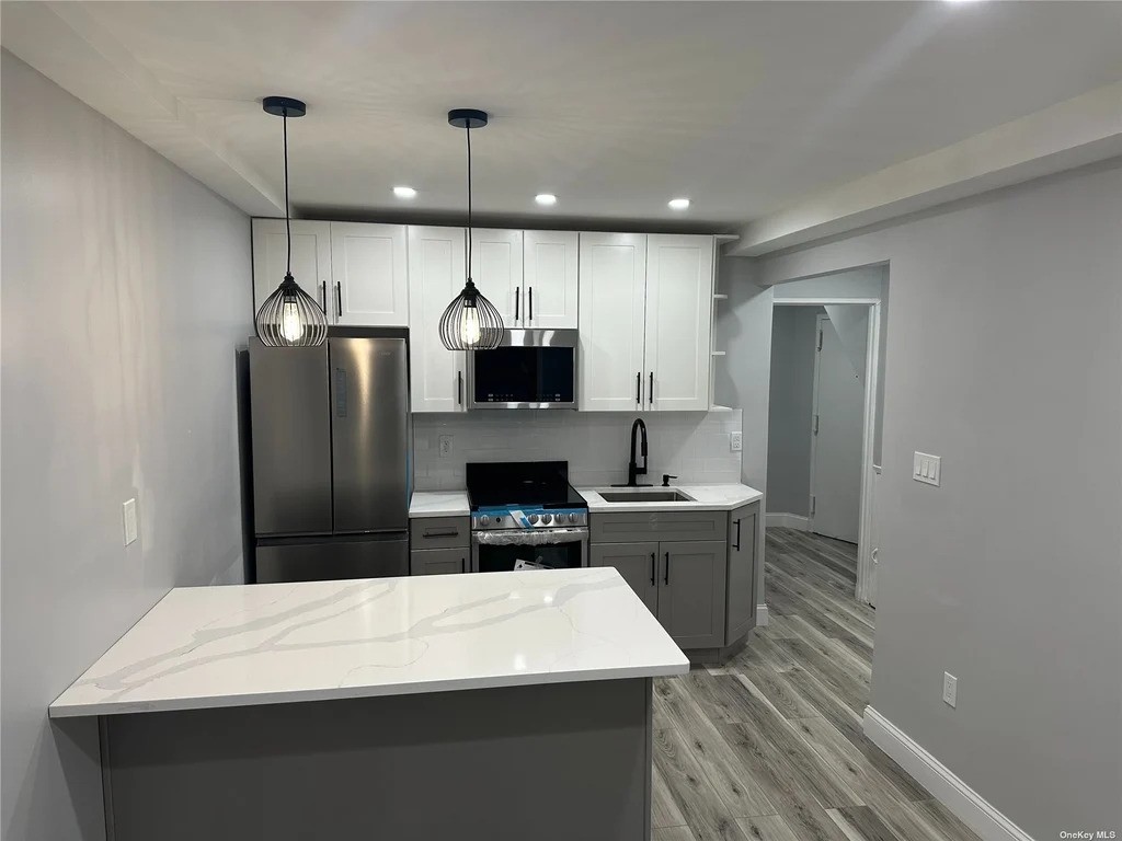 Queens kitchen with stainless steel appliances