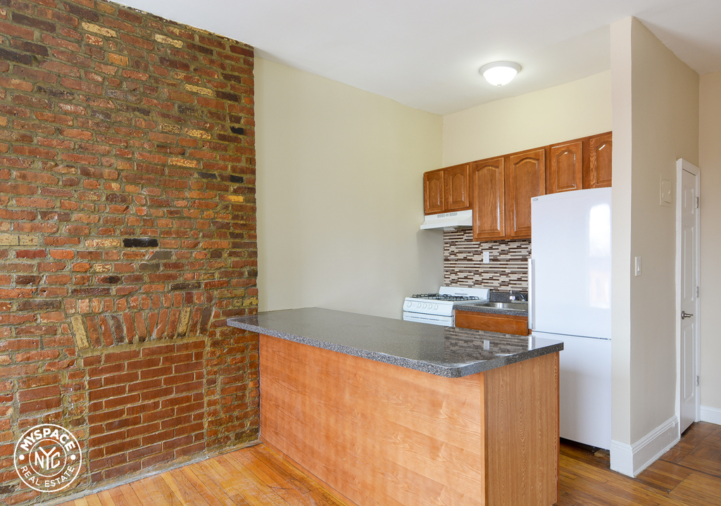 Kitchen with exposed brick in Brooklyn