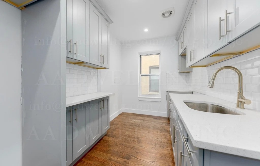 Kitchen with light wood cabinets