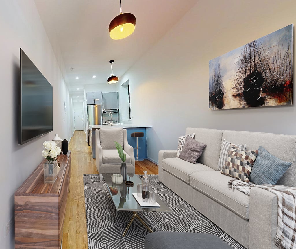 Open-concept kitchen and living room in Brooklyn apartment