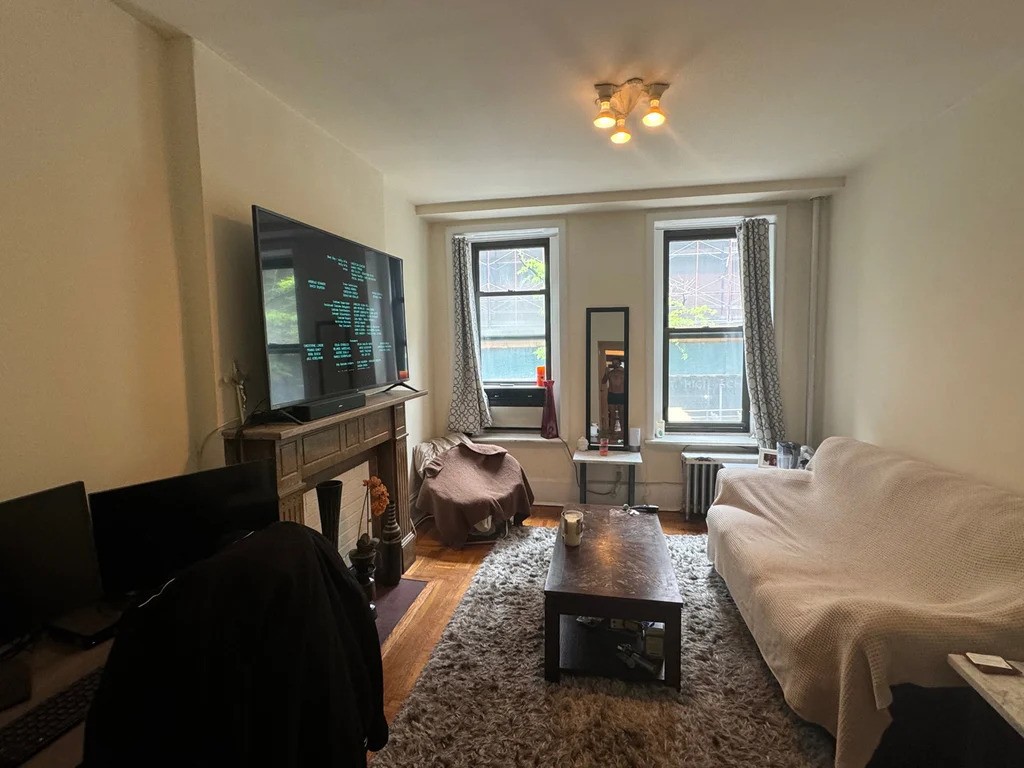 Manhattan studio with a decorative fireplace