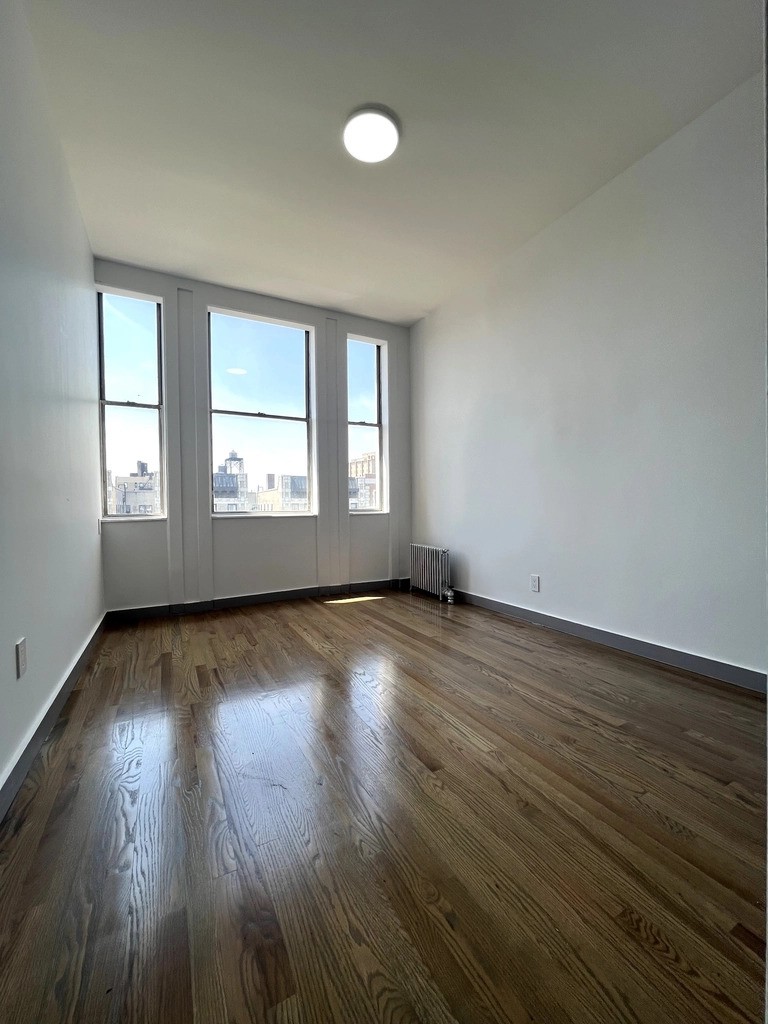 Manhattan bedroom with oversized windows