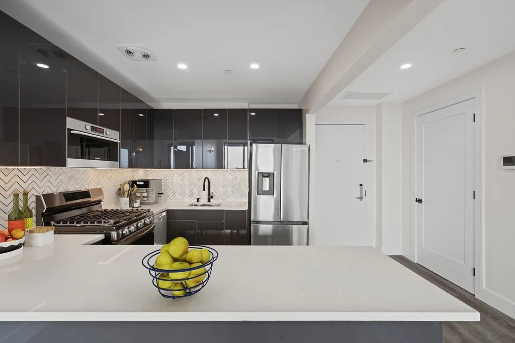 Modern kitchen with stainless steel appliances in 2025