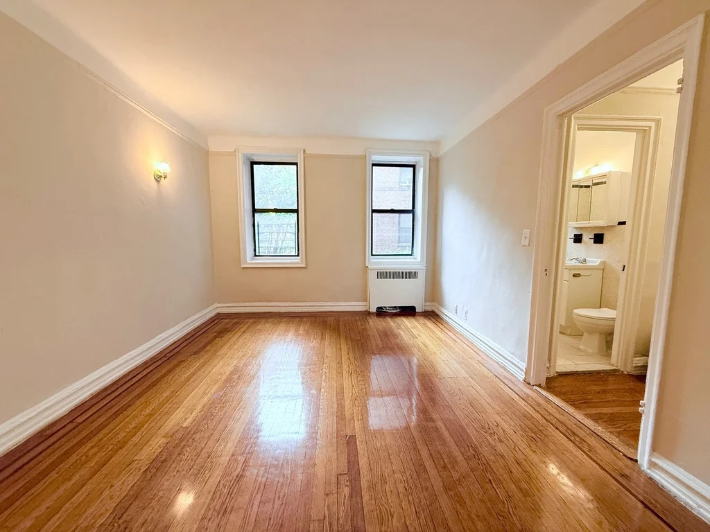 Spacious studio living area in a Queens apartment