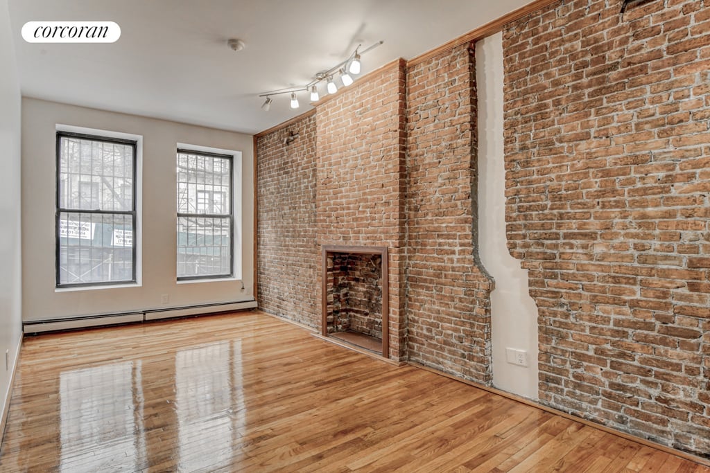 Manhattan apartment with exposed brick and a fireplace