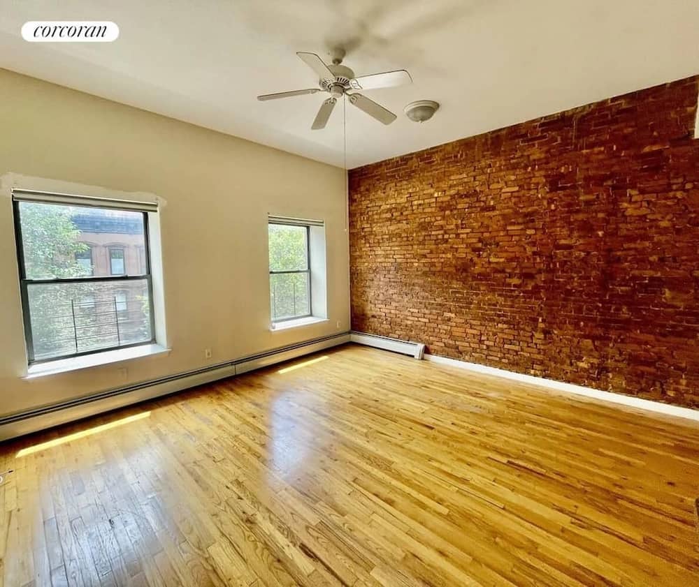 East Harlem apartment spacious living room in October 2025