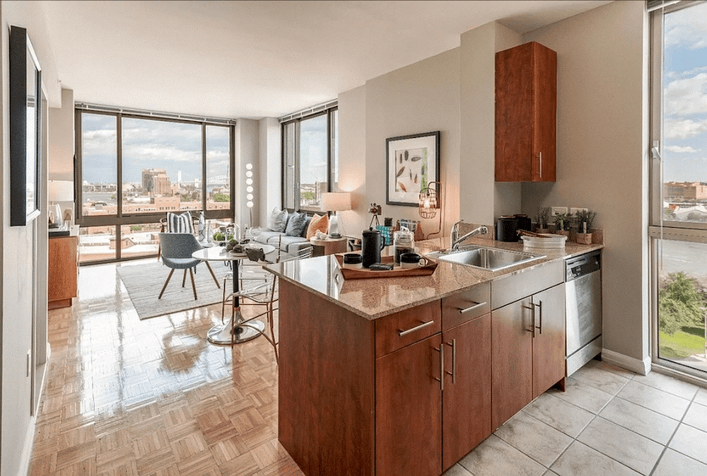 Kitchen and living room with natural light in September of 2025