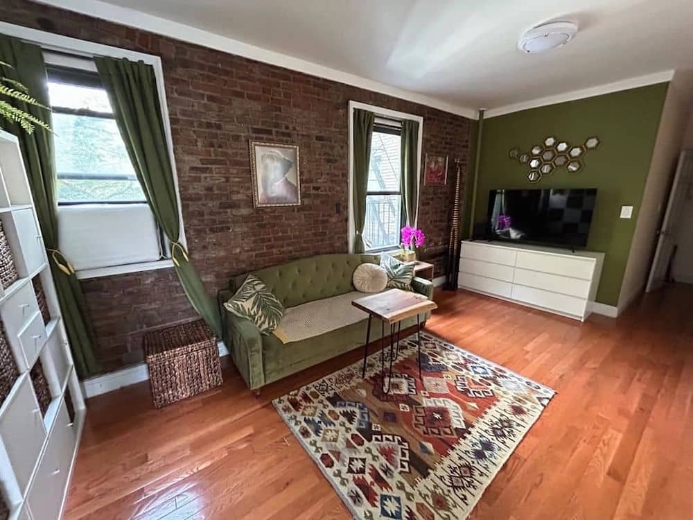 Astoria one bedroom apartment with exposed brick in December of 2025