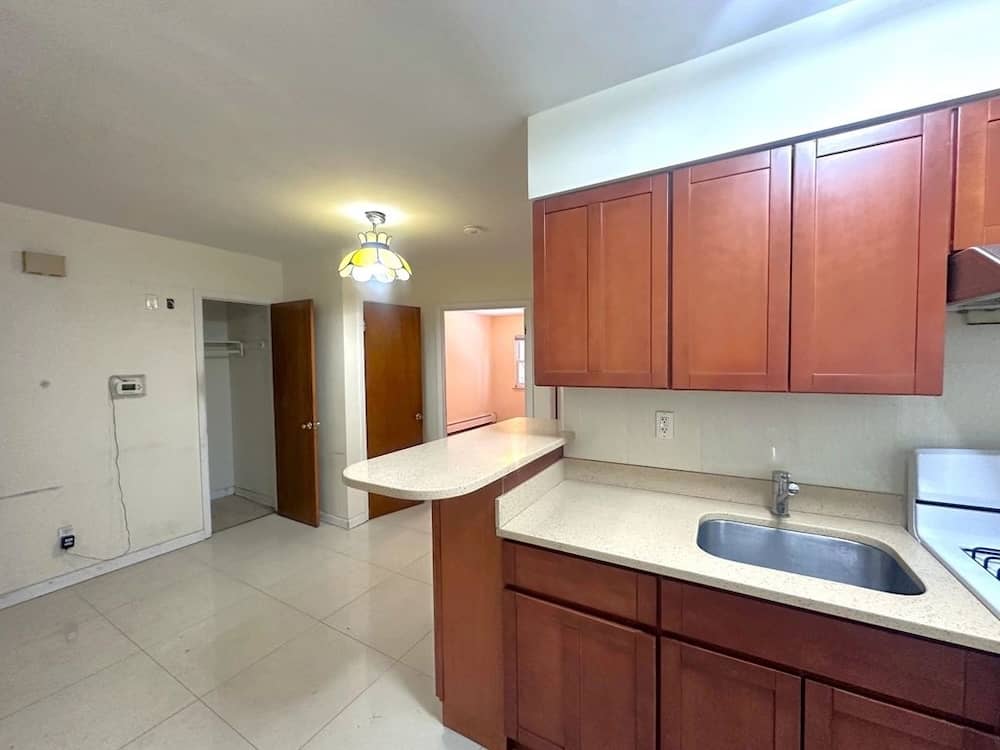Kew Gardens listing with with available parking in April of 2026