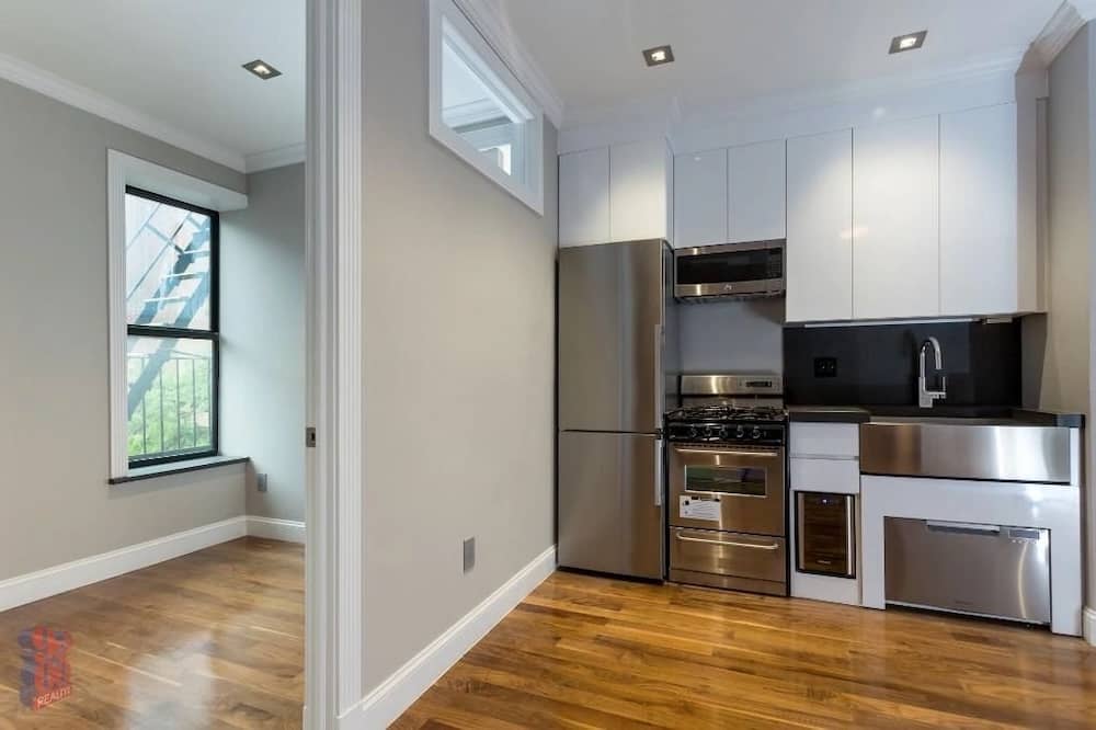 Harlem one bedroom apartment with exposed brick walls in April of 2026