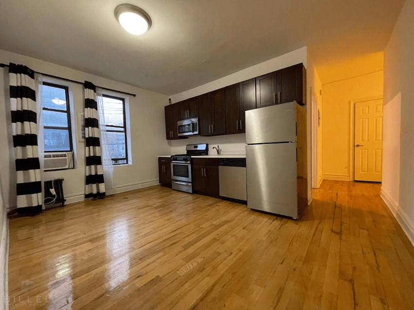 Astoria apartment with open kitchen layout in July of 2026