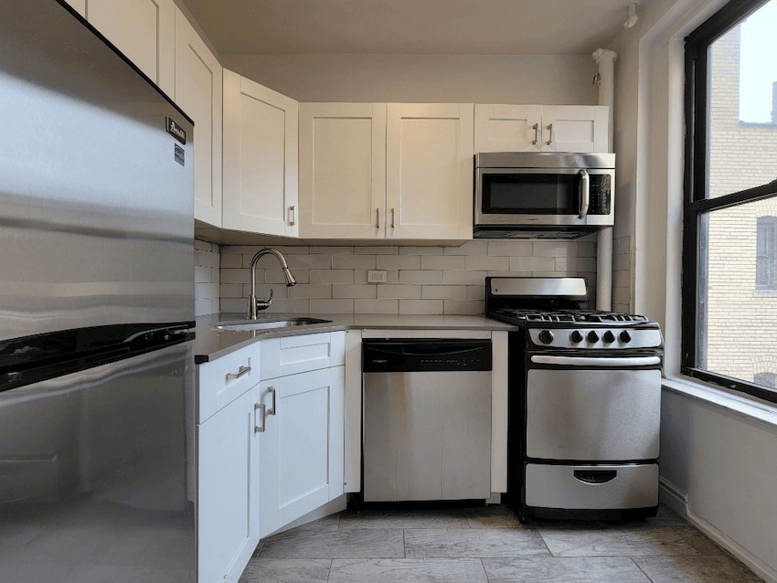Flushing apartment kitchen with stainless steel appliances in July of 2026