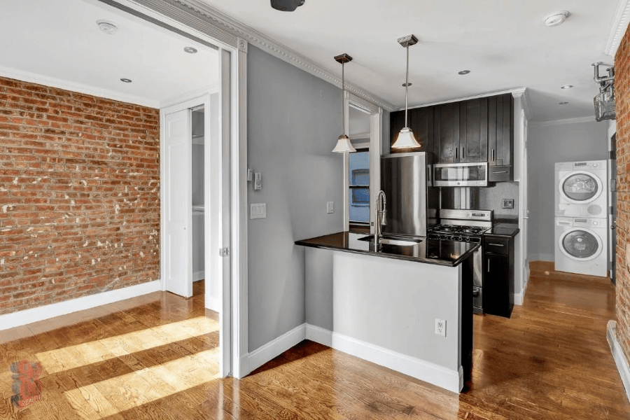 Harlem two bedroom apartment with brick walls in July of 2026