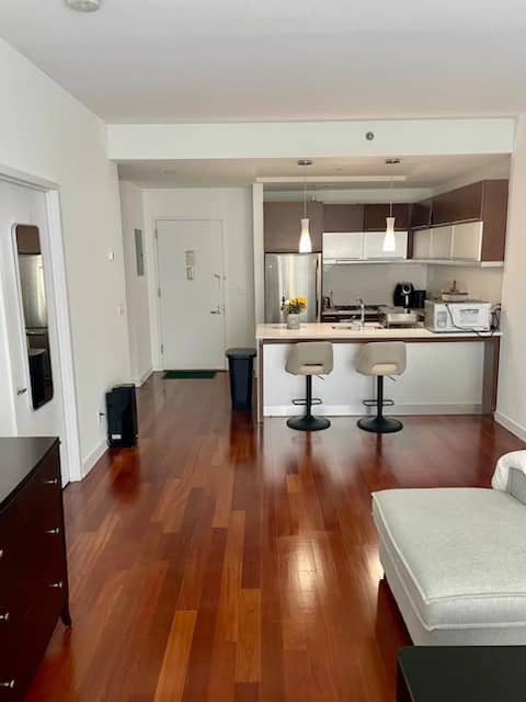 Long Island City unit with an open kitchen in August of 2026