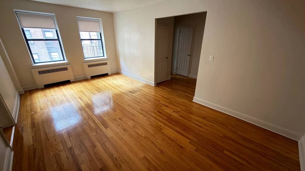 Rego Park unit with hardwood flooring in October of 2026
