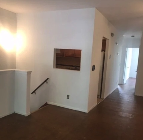 apartment photo of empty space with stairwell