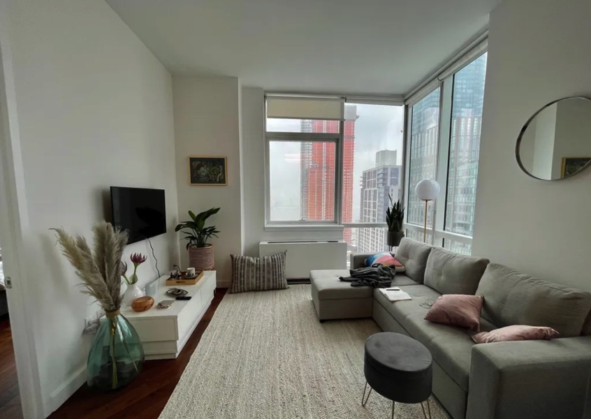 apartment photo of living room with tv, sofa, and coffee table