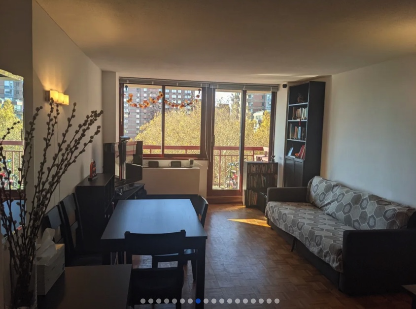 apartment photo of living room with couch, coffee table, tv area