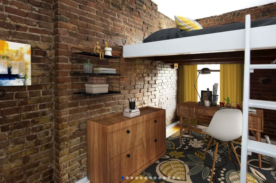apartment photo of bedroom with lofted bed and office space underneath lofted bed