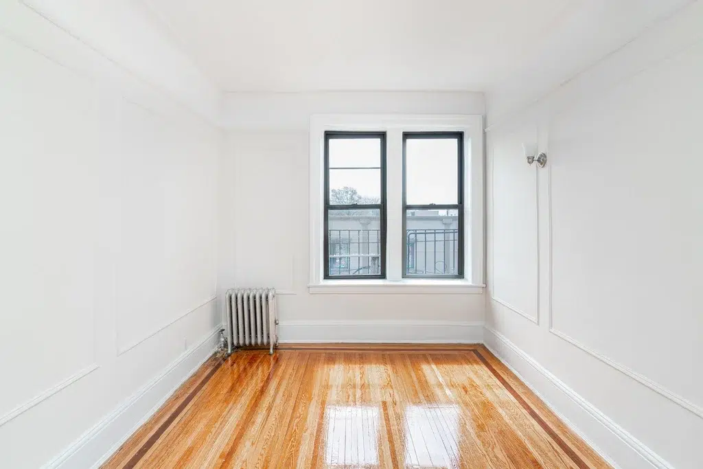 apartment listing photo of empty room with windows