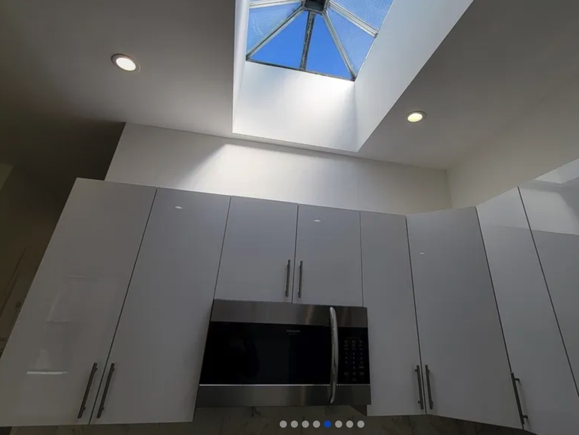 apartment listing photo of kitchen and skylight above