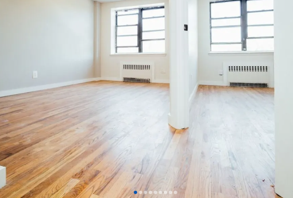 apartment listing photo of empty bedrooms with windows