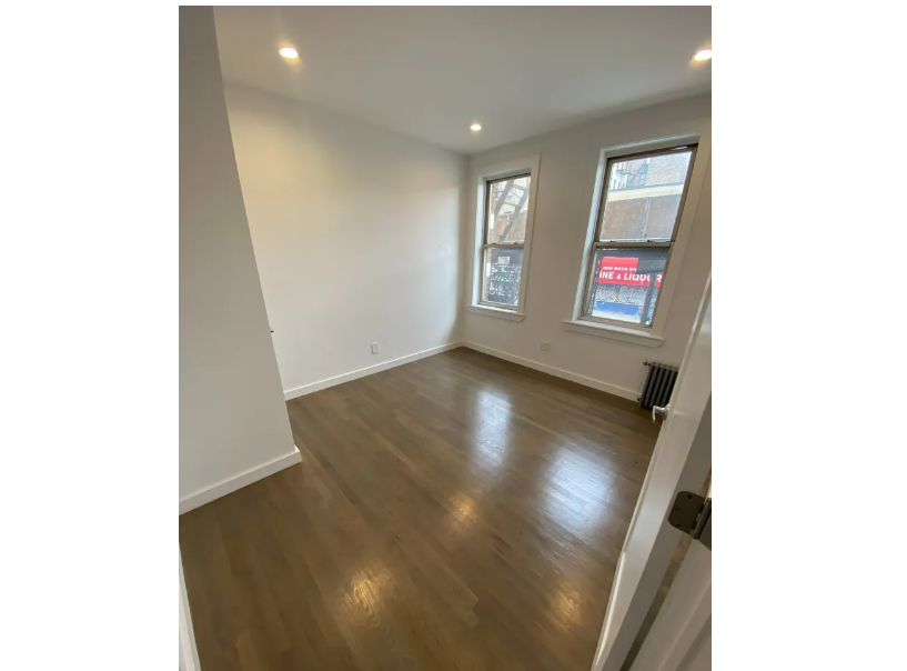 apartment photo of empty bedroom with windows