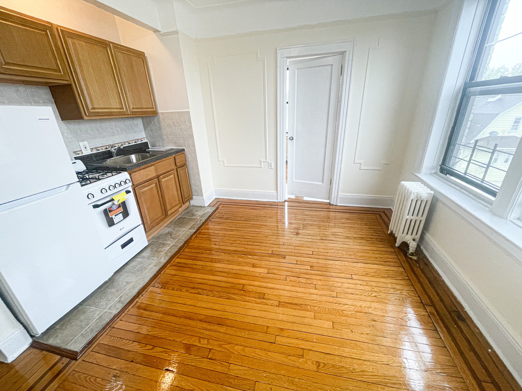 kitchen with door to other room
