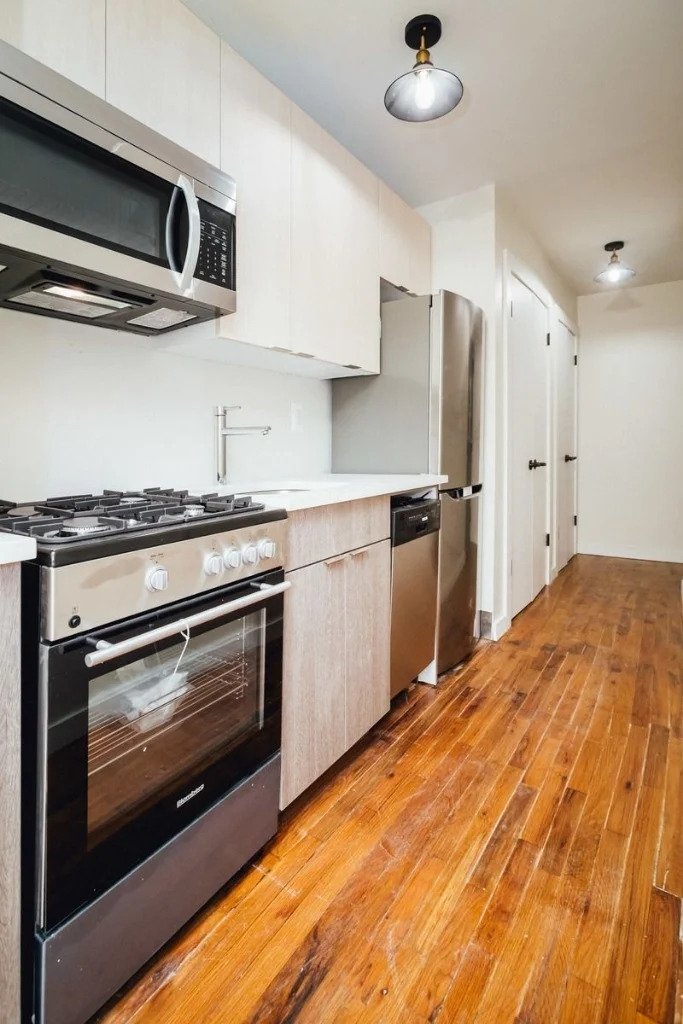 kitchen with door to other room