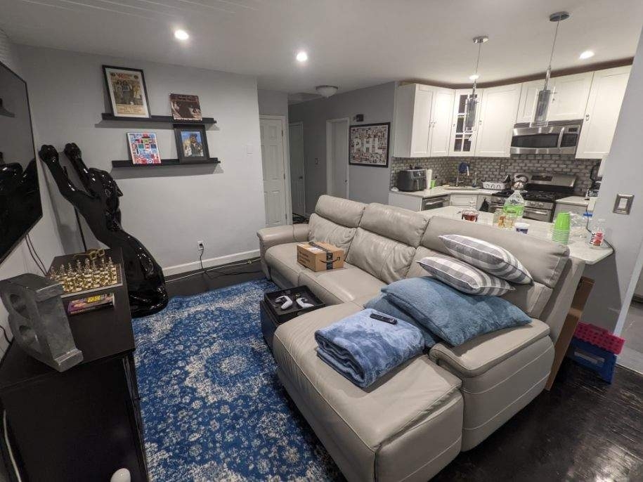 living room and kitchen with large couch