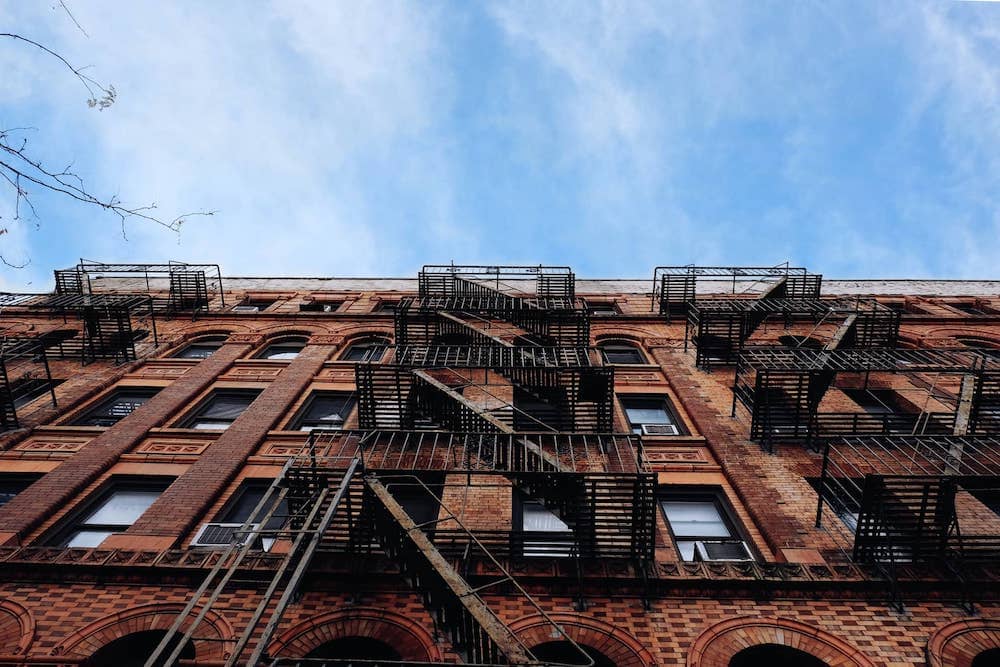 A view of the sky and building facade from below