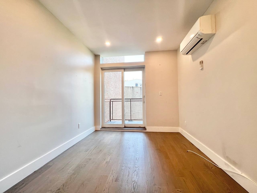 photo of bright and spacious room with a balcony