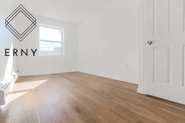 photo of large studio room with a window