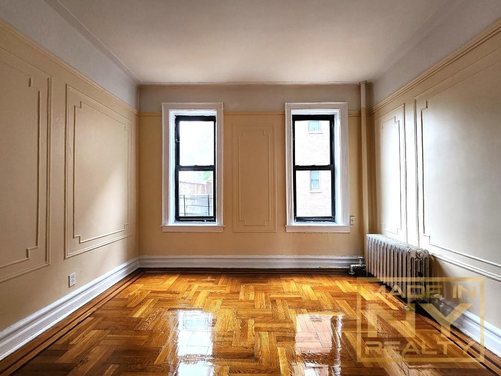 living room with two windows and molding