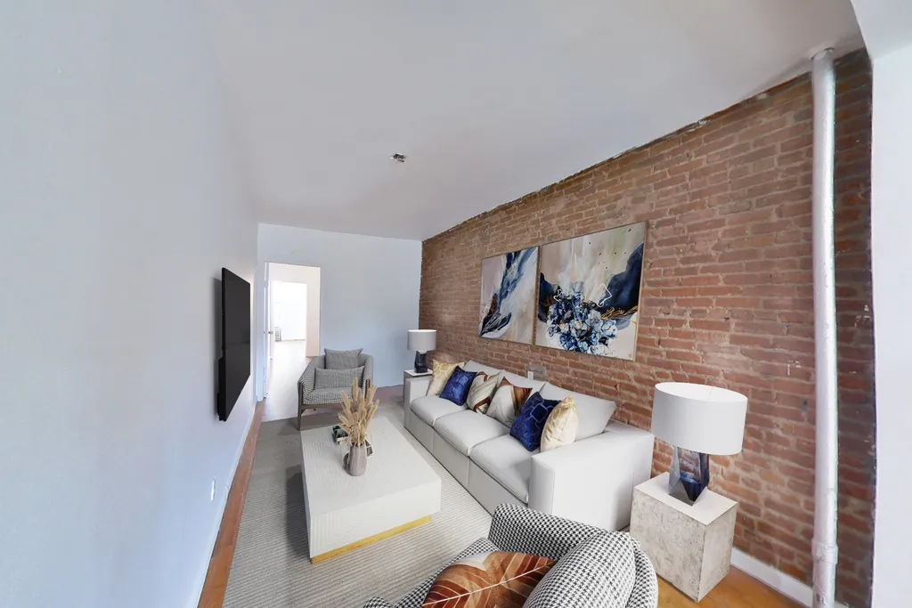 photo of living space with exposed brick
