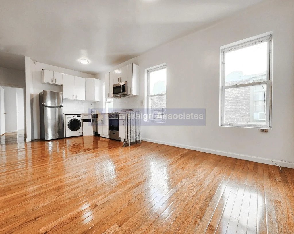 large living space with washer and stainless steel appliances