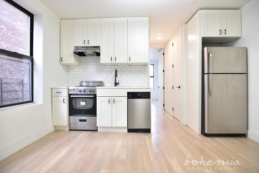 bright living area with kitchen