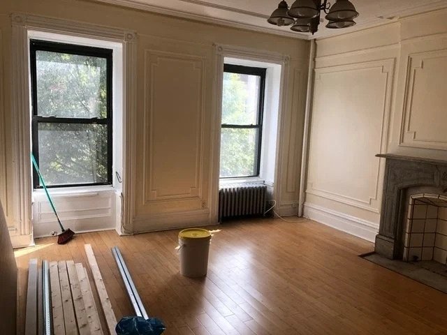 room with fireplace and molding