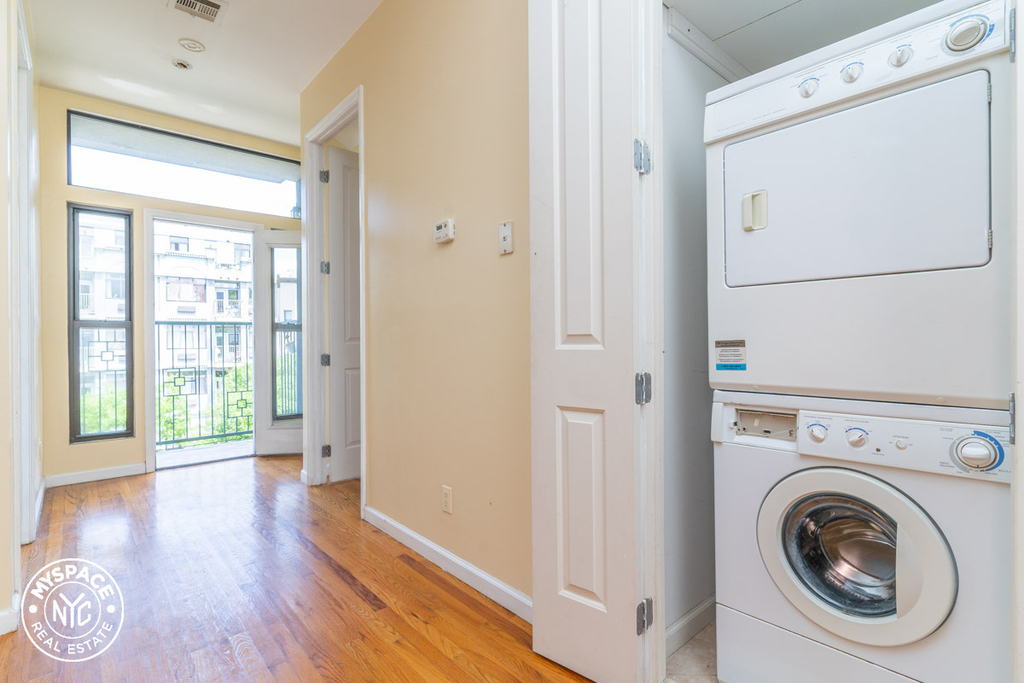 In-unit laundry and living room