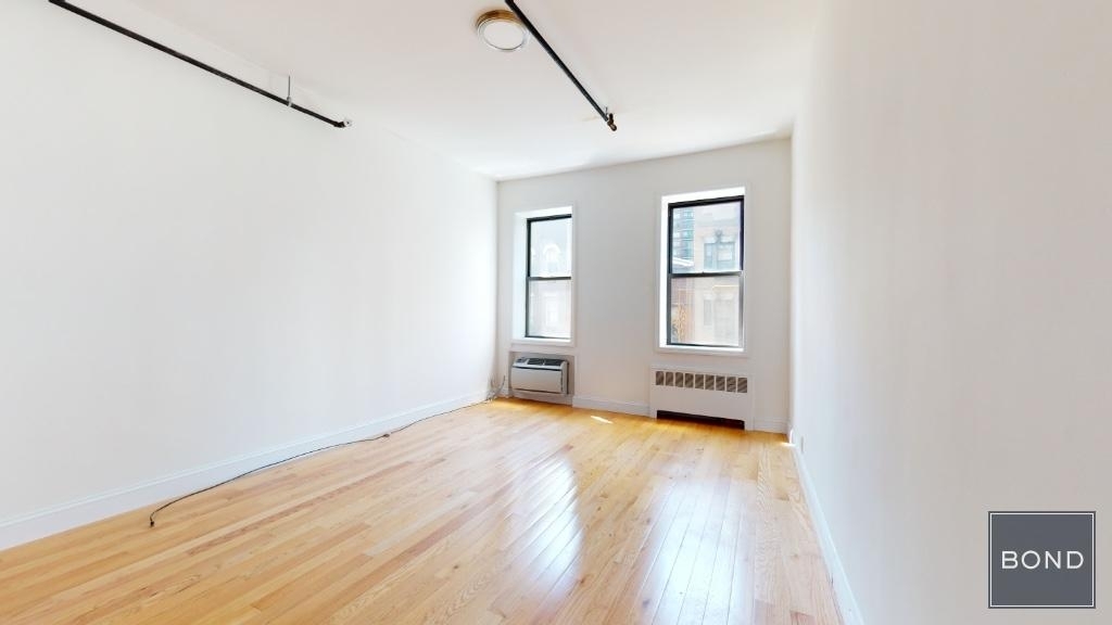 Bedroom with two windows