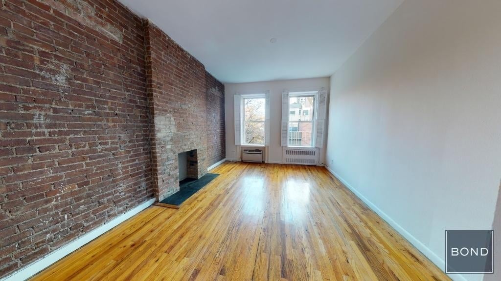 Living room with exposed brick
