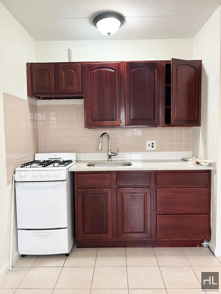 Kitchen space with dark cabinets