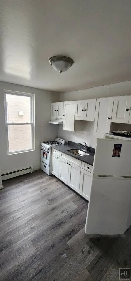 Kitchen with white cabinets